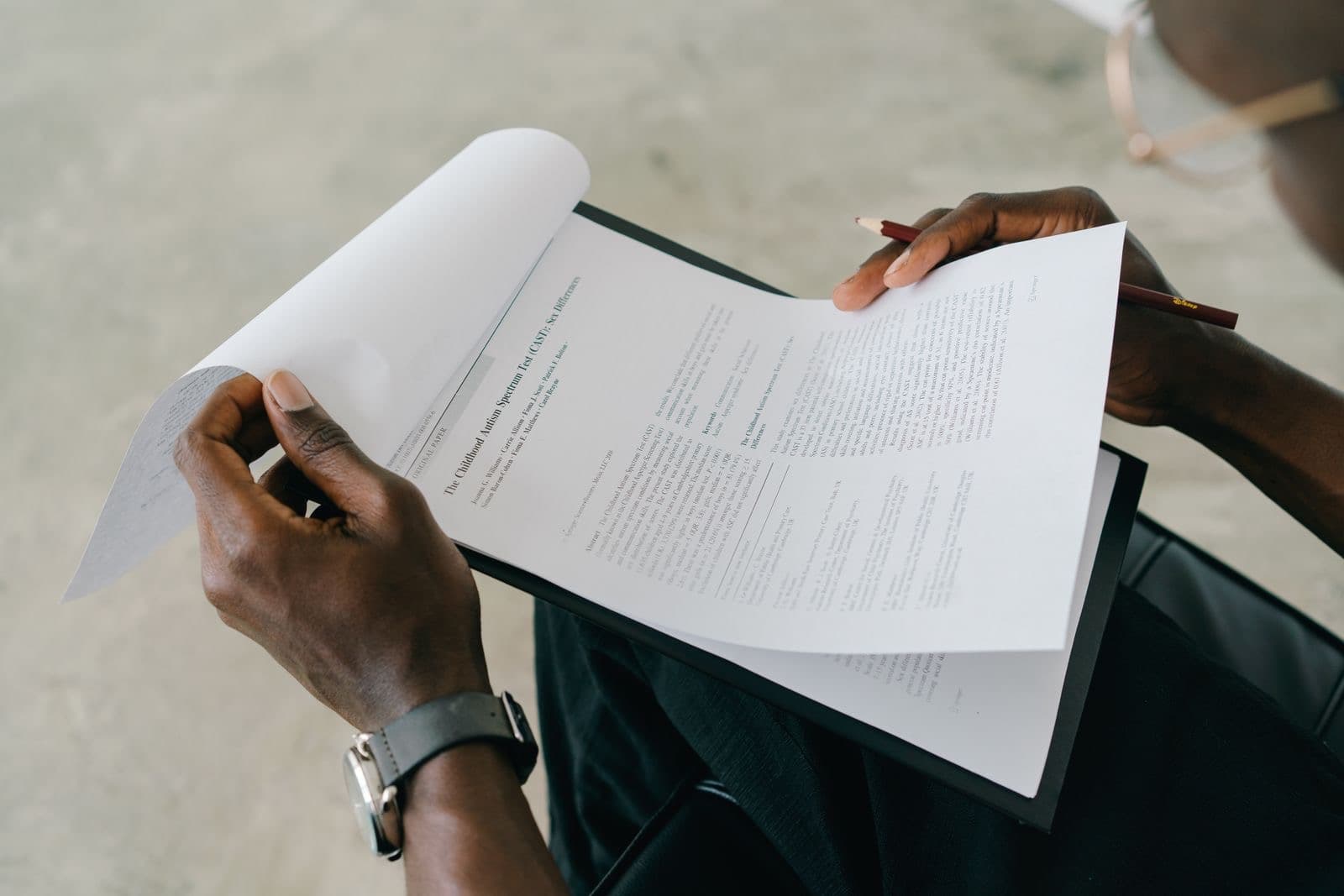 Reviewing a document with a pen in hand