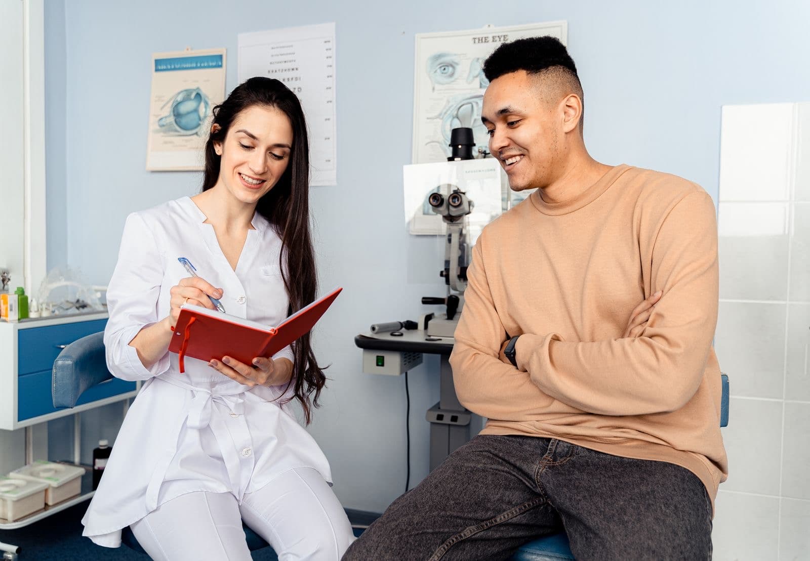 A clinician talking with a patient in a consulting room
