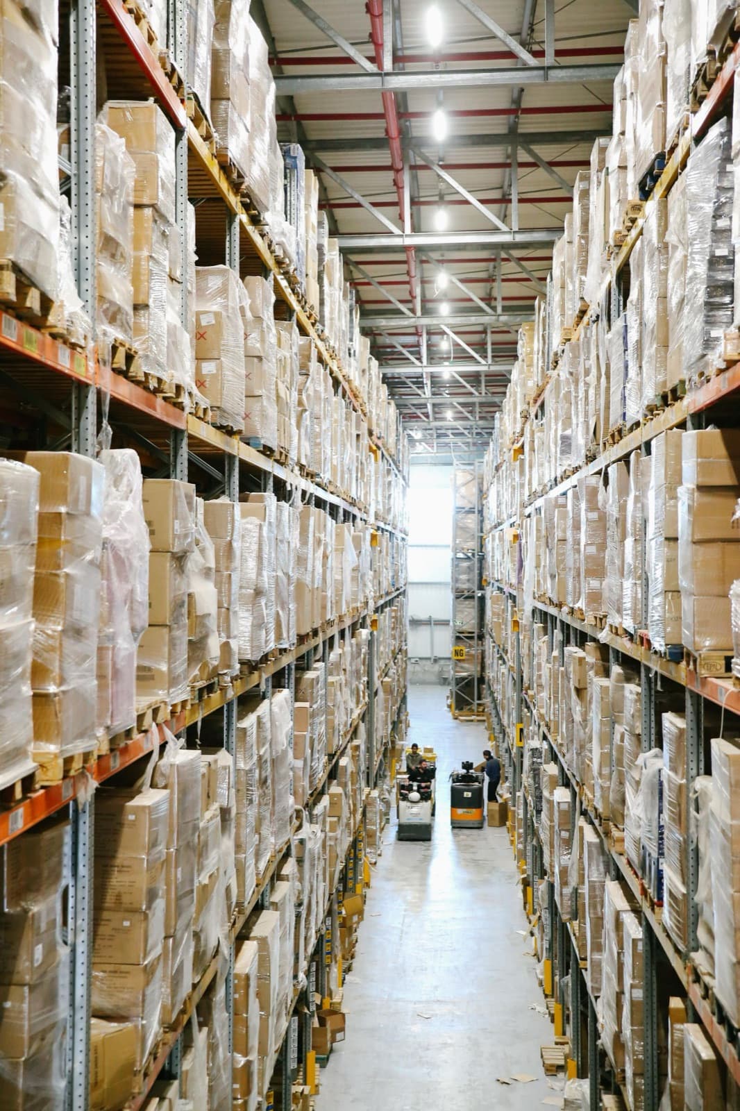 Warehouse aisle with shelves of boxed stock